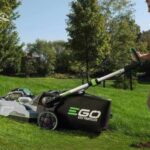EGO lawnmower mower the grass on a hill. Keep lawnmower blades sharp with Ace blade sharpening services