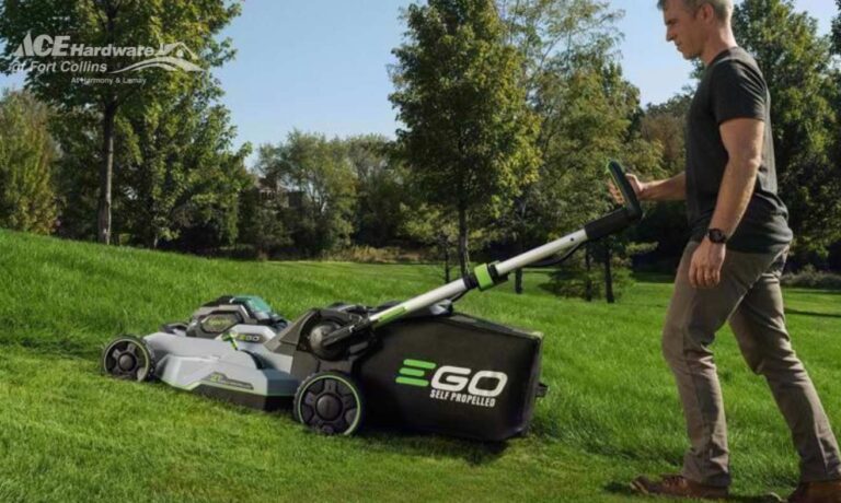 EGO lawnmower mower the grass on a hill. Keep lawnmower blades sharp with Ace blade sharpening services