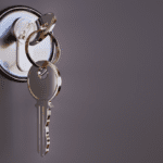 Photo of key in door lock.