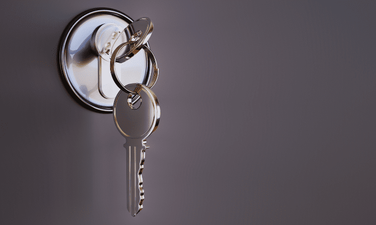 Photo of key in door lock.
