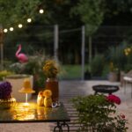Outdoor space with lighting and furniture - Simple Ways to Make Your Summer Nights Shine