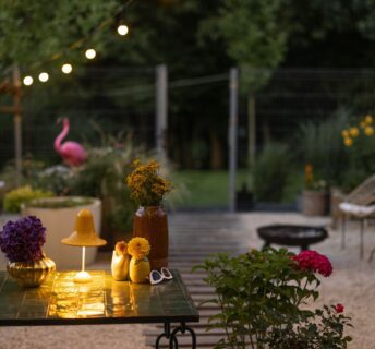 Outdoor space with lighting and furniture - Simple Ways to Make Your Summer Nights Shine
