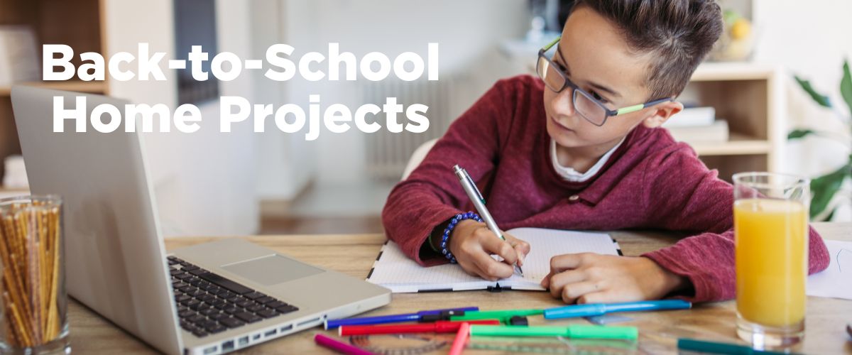 Kid at table doing homework. Back-to-School Home Projects